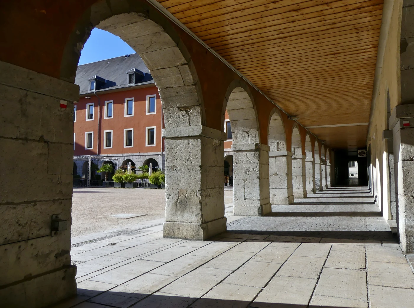 Sight, enlighted by the setting sun in the early morning, of the western gallery and part of the inner court of the Carré Curial building, in Chambéry, Savoie, France.